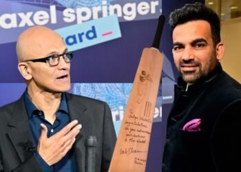 Satya Nadella receives an autographed bat from Zaheer Khan at Axel Springer Awards